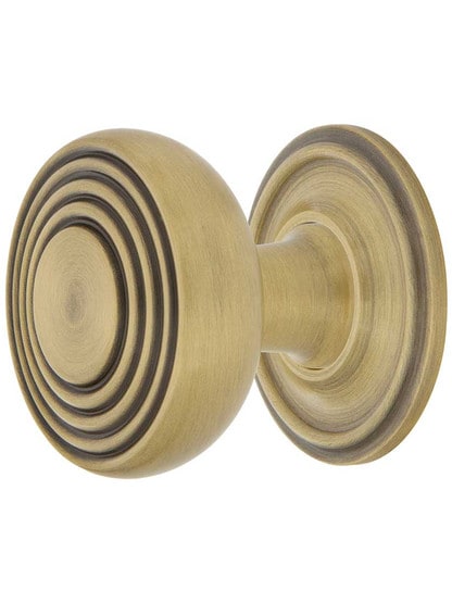 Streamline Deco Cabinet Knob - 1 3/8 inch Diameter with Classic Rosette in Antique Brass.